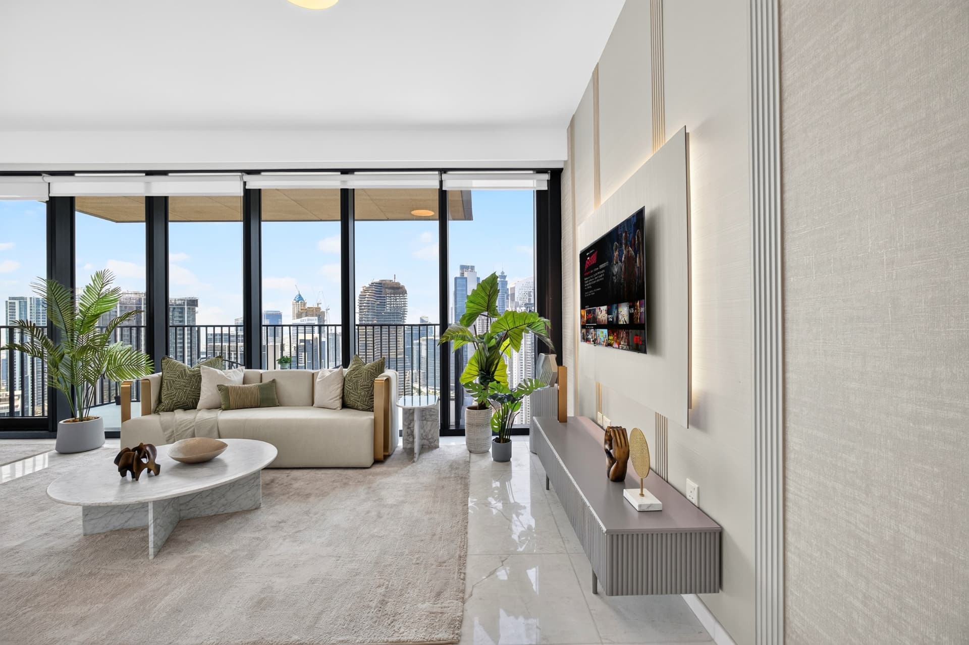 Boulevard Heights living room with floor-to-ceiling glazing and fluted console