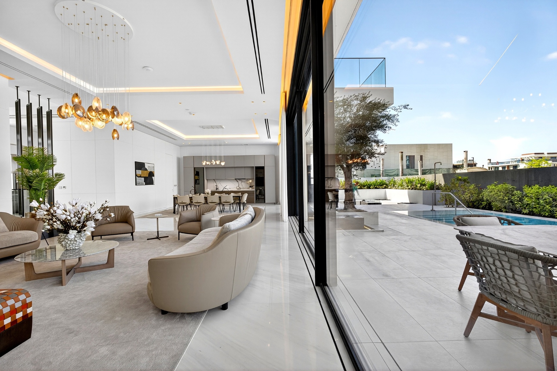 Villa A9 open-plan living room flowing to the terrace and pool